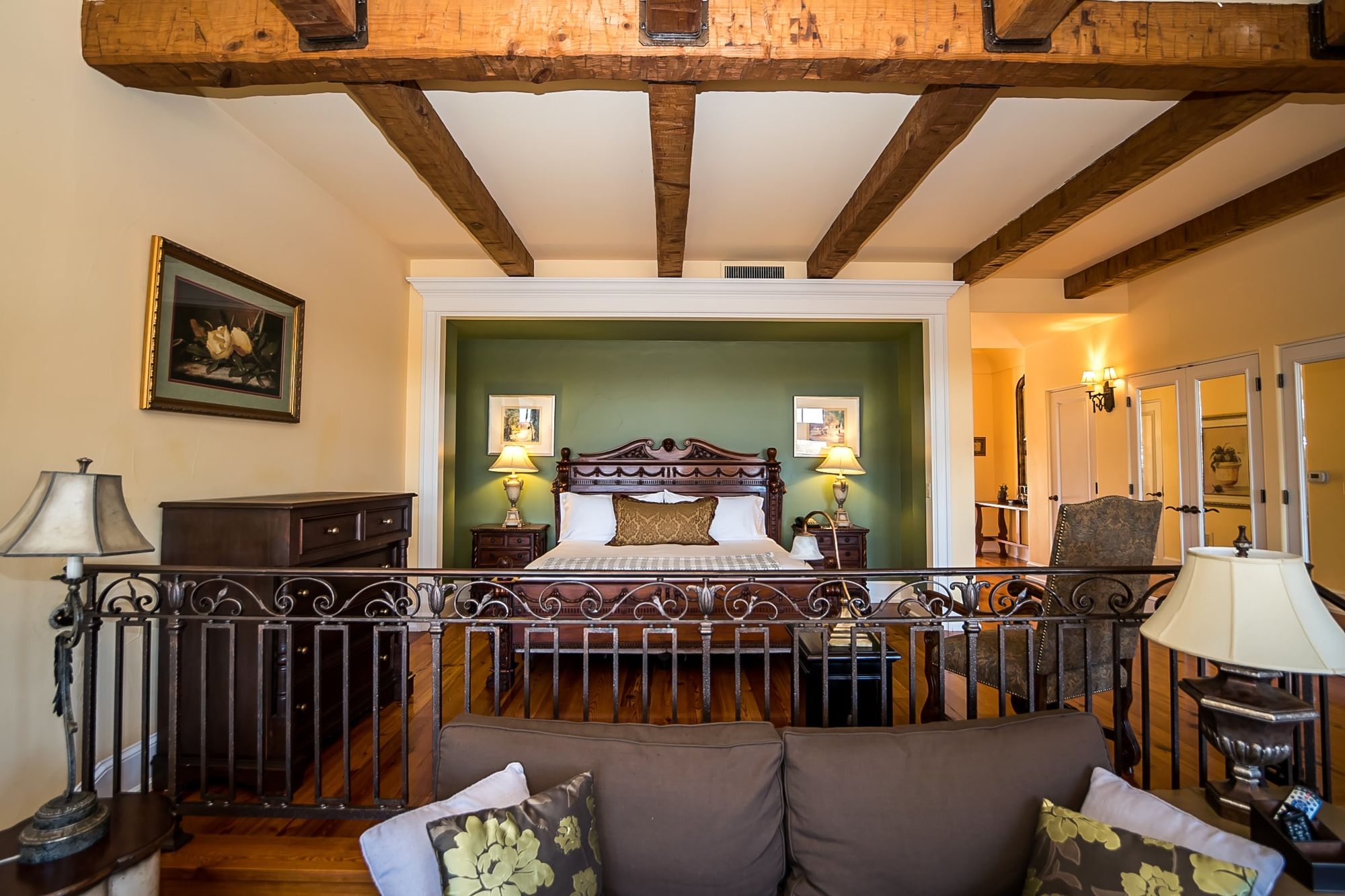 Viognier-12-of-14_c7b8fab4541d950a91f126021f5e95da Bed with lighting on each side in green walled niche and sitting area in the foreground